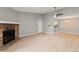 Living room features a fireplace, and an open layout leading to the kitchen area at 8600 E Alameda Ave # 22-208, Denver, CO 80247