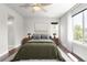 Calm bedroom featuring a large window and neutral decor at 12714 E Dickenson Ave, Aurora, CO 80014