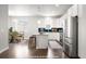 Modern kitchen featuring stainless steel appliances and ample counter space at 12714 E Dickenson Ave, Aurora, CO 80014