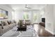 Bright living room with stylish furniture and hardwood floors at 12714 E Dickenson Ave, Aurora, CO 80014