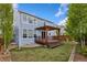 Inviting backyard featuring a wooden deck with a pergola, perfect for outdoor relaxation and entertaining at 713 San Juan Dr, Lafayette, CO 80026