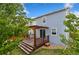 Backyard view with a spacious wooden deck, pergola and a well-maintained lawn at 713 San Juan Dr, Lafayette, CO 80026