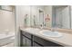 Well-lit bathroom featuring double sinks, a large mirror, and a 'Splash-Splash' sign at 713 San Juan Dr, Lafayette, CO 80026