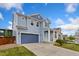 Lovely two-story home with a blue exterior, attached garage, and a welcoming covered front porch at 713 San Juan Dr, Lafayette, CO 80026