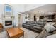 Living room featuring a fireplace, hardwood floors, and a comfortable leather sectional at 713 San Juan Dr, Lafayette, CO 80026