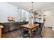 Open concept living area featuring a kitchen, dining table and a comfortable sectional couch at 713 San Juan Dr, Lafayette, CO 80026