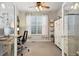 Bright home office featuring a ceiling fan, a window with curtains, and a white storage cabinet at 713 San Juan Dr, Lafayette, CO 80026
