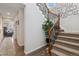 Inviting staircase with carpeted steps, decorative railing, and stylish picture frames on the wall at 713 San Juan Dr, Lafayette, CO 80026
