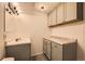 Bathroom featuring modern cabinets, countertops, sink, and updated fixtures at 9295 W 80Th Pl # A, Arvada, CO 80005