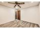 Comfortable bedroom featuring neutral carpet, ceiling fan, and an adjacent room at 9295 W 80Th Pl # A, Arvada, CO 80005