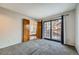 Light bedroom with a large sliding glass door and a private outdoor view at 9295 W 80Th Pl # A, Arvada, CO 80005