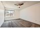 Bright bedroom featuring a ceiling fan, soft carpeting, and a window with a view at 9295 W 80Th Pl # A, Arvada, CO 80005