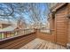 Wooden deck with neighborhood views and wood railing at 9295 W 80Th Pl # A, Arvada, CO 80005
