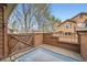Relaxing wood deck with a rug and gate providing outdoor comfort and privacy at 9295 W 80Th Pl # A, Arvada, CO 80005