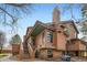 Charming multi-story townhouse with wood siding, and steps leading to the entrance at 9295 W 80Th Pl # A, Arvada, CO 80005