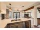 Bright kitchen boasts a modern design, granite countertops, and stainless steel appliances at 9295 W 80Th Pl # A, Arvada, CO 80005