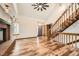 Spacious living room featuring wood floors, fireplace, staircase, and a vaulted ceiling at 9295 W 80Th Pl # A, Arvada, CO 80005
