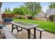 Enjoy outdoor dining on the patio of this well-maintained backyard, perfect for entertaining at 6342 Marshall St, Arvada, CO 80003