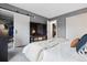 Inviting bedroom featuring a walk-in closet and sliding door, complemented by gray walls at 6342 Marshall St, Arvada, CO 80003