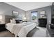 Relaxing bedroom with soft carpet, natural light, and neutral gray decor at 6342 Marshall St, Arvada, CO 80003