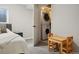 Stacked washer and dryer sit next to a table in this multi-purpose room at 6342 Marshall St, Arvada, CO 80003