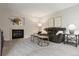 Bright living room featuring a fireplace, comfortable seating, stylish decor, and ample natural light at 6342 Marshall St, Arvada, CO 80003