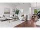 Bright living room features hardwood floors, high ceilings, and a neutral color palette at 6342 Marshall St, Arvada, CO 80003