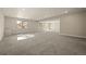 Spacious finished basement with large windows, recessed lights, and neutral walls and carpet at 8048 Grady Cir, Castle Rock, CO 80108