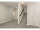 Finished basement area with stairs and door, offering versatile space for various uses at 8048 Grady Cir, Castle Rock, CO 80108