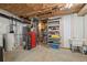 Basement with water heater, and shelving units offering ample storage solutions at 8048 Grady Cir, Castle Rock, CO 80108
