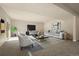 Finished basement featuring living area with TV, sofa, chairs, recessed lights, and neutral tones at 8048 Grady Cir, Castle Rock, CO 80108