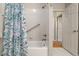 Bathtub/shower combo with a tiled wall, shower curtain, and a white wall at 8048 Grady Cir, Castle Rock, CO 80108
