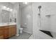 Bathroom featuring a glass-enclosed shower with rainfall showerhead, bench, and modern finishes at 8048 Grady Cir, Castle Rock, CO 80108