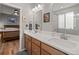 Bright bathroom features a double sink vanity with white countertops and modern fixtures at 8048 Grady Cir, Castle Rock, CO 80108