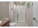 Bathroom featuring a glass door shower and neutral-toned walls, exuding a clean and modern aesthetic at 8048 Grady Cir, Castle Rock, CO 80108