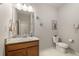 Bathroom showcasing a vanity with granite countertop, white walls, and a toilet at 8048 Grady Cir, Castle Rock, CO 80108