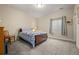 Comfortable bedroom featuring a bed with a floral comforter and a window with blinds at 8048 Grady Cir, Castle Rock, CO 80108