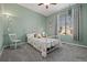 Bedroom with light green walls, a ceiling fan, and a window with blinds and curtains at 8048 Grady Cir, Castle Rock, CO 80108