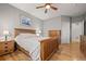 Comfortable bedroom with hardwood floors, ceiling fan, and ample closet space at 8048 Grady Cir, Castle Rock, CO 80108
