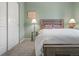 Bedroom featuring light green walls, neutral carpet, and a full sized bed at 8048 Grady Cir, Castle Rock, CO 80108