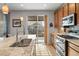 Bright kitchen featuring stainless steel appliances, granite counters, and sliding door access to the deck at 8048 Grady Cir, Castle Rock, CO 80108