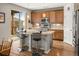 Stylish kitchen with a granite island, stainless steel appliances, and wooden cabinetry at 8048 Grady Cir, Castle Rock, CO 80108