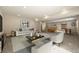 Large living room with comfortable seating, a TV, and an open layout to a game area at 8048 Grady Cir, Castle Rock, CO 80108