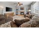 Comfortable living room with a stone fireplace and a neutral color palette at 8048 Grady Cir, Castle Rock, CO 80108