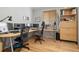 Bright office space featuring hardwood floors, natural lighting, and modern ceiling fan at 8048 Grady Cir, Castle Rock, CO 80108