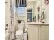 Charming bathroom with a floral shower curtain and a single sink vanity at 15347 Quince Cir, Thornton, CO 80602