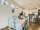 Bright dining area features hardwood floors, pendant lighting, and views into the kitchen at 15347 Quince Cir, Thornton, CO 80602