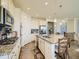 Bright kitchen features granite counters, stainless appliances, and a large center island at 15347 Quince Cir, Thornton, CO 80602
