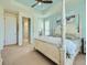 Serene main bedroom boasts a tray ceiling, and a four-poster bed, with en-suite bathroom access at 15347 Quince Cir, Thornton, CO 80602