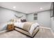 Bright basement bedroom with a comfortable bed and ample closet space at 3200 S Grape St, Denver, CO 80222